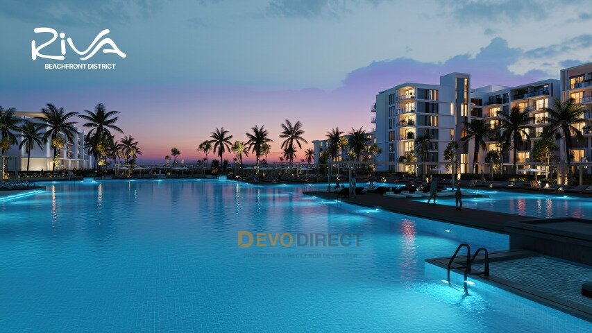 Exclusive pool area with illuminated water surface and resort atmosphere Exclusive pool area with illuminated water surface and resort atmosphere